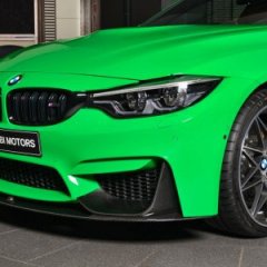 Купе BMW M4 в Individual Signal Green на BMW Abu Dhabi Motors